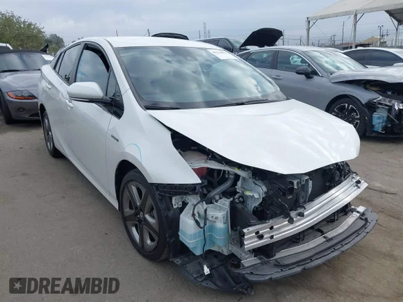 ✅ 2020 Toyota Prius L Eco • VIN: JTDKARFU6L3107528 • Lot: 43270851. Listed on IAAI with 36,230 mi. Free auction sales archive from the USA and detailed vehicle history report at DreamBid. Image 1.