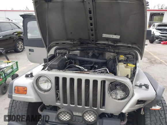 ✅ 2002 Jeep Wrangler Sport • VIN: 1J4FA49S62P701472 • Лот: 45321377. Опубліковано раніше на IAAI з пробігом 208 911 миль. Безкоштовний доступ до архіву аукціонних продажів зі США та докладний звіт про історію автомобіля на DreamBid. Зображення 10.