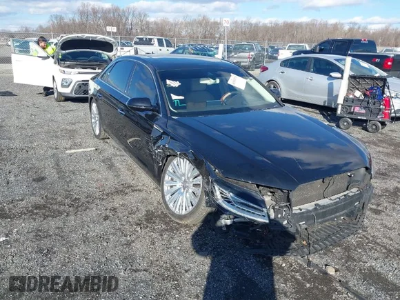 ✅ 2015 Audi A8 4.0T • VIN: WAU32AFD4FN014063 • Lot: 41501970. Listed on IAAI with 158,570 mi. Free auction sales archive from the USA and detailed vehicle history report at DreamBid. Image 1.