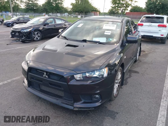✅ 2014 Mitsubishi Lancer Evolution GSR • VIN: JA32W8FV4EU024695 • Лот: 42756540. Опубліковано раніше на IAAI з пробігом 101 479 миль. Безкоштовний доступ до архіву аукціонних продажів зі США та докладний звіт про історію автомобіля на DreamBid. Зображення 2.
