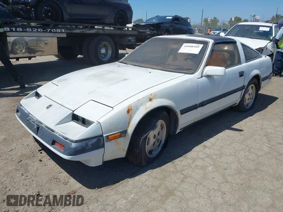 ✅ 1984 Nissan 300ZX • VIN: JN1HZ14S8EX009928 • Лот: 44908109. Опубліковано раніше на IAAI з пробігом 187 591 миль. Безкоштовний доступ до архіву аукціонних продажів зі США та докладний звіт про історію автомобіля на DreamBid. Зображення 2.