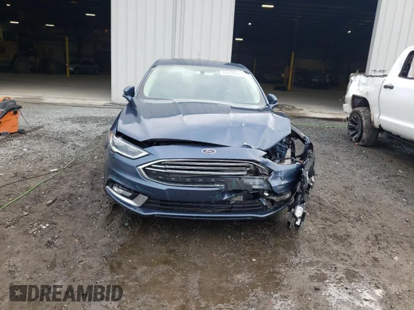 ✅ 2018 Ford Fusion Titanium • VIN: 3FA6P0D93JR128240 • Лот: 72341922. Опубликован ранее на Copart с пробегом 86 329 миль. Бесплатный доступ к архиву аукционных продаж из США и подробный отчёт об истории автомобиля на DreamBid. Изображение 5.