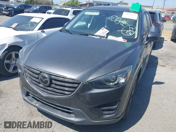 ✅ 2016 Mazda CX-5 Grand Touring • VIN: JM3KE2DY5G0890888 • Lot: 44832835. Wystawiony na IAAI z przebiegiem 93 158 mil. Bezpłatny archiwum sprzedaży aukcyjnych z USA i szczegółowy raport historii pojazdu na DreamBid. Zdjęcie 2.