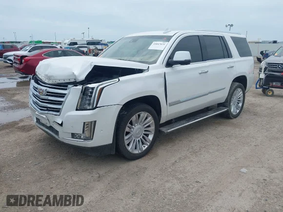 ✅ 2020 Cadillac Escalade Platinum • VIN: 1GYS3DKJ8LR151790 • Lot: 45047631. Wystawiony na IAAI z przebiegiem 127 262 mil. Bezpłatny archiwum sprzedaży aukcyjnych z USA i szczegółowy raport historii pojazdu na DreamBid. Zdjęcie 2.