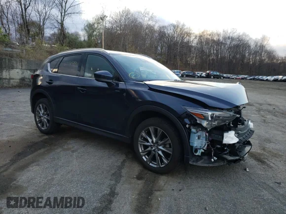 ✅ 2021 Mazda CX-5 Signature • VIN: JM3KFBEY0M0345866 • Лот: 67550382. Опубліковано раніше на Copart з пробігом 9 472 миль. Безкоштовний доступ до архіву аукціонних продажів зі США та докладний звіт про історію автомобіля на DreamBid. Зображення 4.