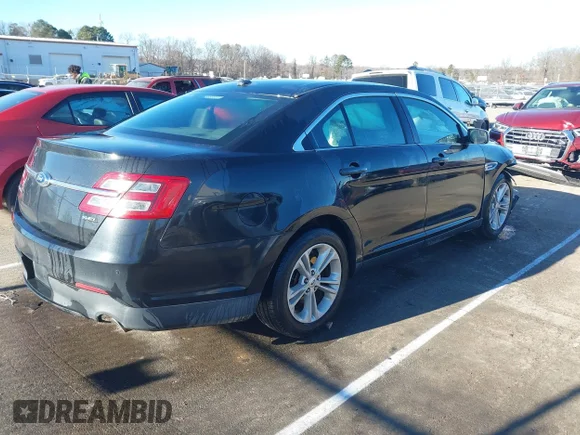 ✅ 2015 Ford Taurus SEL • VIN: 1FAHP2E89FG179587 • Lot: 41305729. Listed on IAAI with 122,533 mi. Free auction sales archive from the USA and detailed vehicle history report at DreamBid. Image 4.