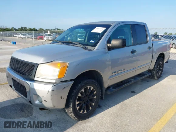 ✅ 2012 Nissan Titan SL • VIN: 1N6BA0ED2CN307658 • Lot: 42369756. Wystawiony na IAAI z przebiegiem 305 852 mil. Bezpłatny archiwum sprzedaży aukcyjnych z USA i szczegółowy raport historii pojazdu na DreamBid. Zdjęcie 2.
