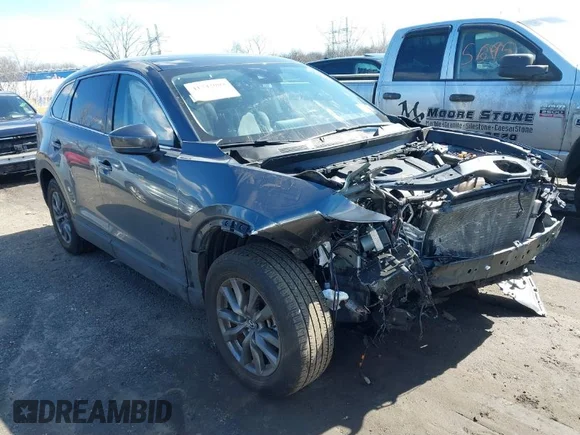 ✅ 2023 Mazda CX-9 Touring • VIN: JM3TCBCY1P0635828 • Lot: 41743004. Listed on IAAI with 31,635 mi. Free auction sales archive from the USA and detailed vehicle history report at DreamBid. Image 1.