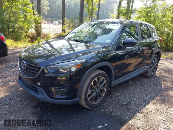 ✅ 2016 Mazda CX-5 Grand Touring • VIN: JM3KE4DY6G0641897 • Lot: 45406381. Listed on IAAI with 172,291 mi. Free auction sales archive from the USA and detailed vehicle history report at DreamBid. Image 2.