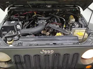 ✅ 2007 Jeep Wrangler Unlimited Sahara • VIN: 1J4GB59157L143188 • Лот: 67048525. Опубликован ранее на Copart с пробегом 219 248 миль. Бесплатный доступ к архиву аукционных продаж из США и подробный отчёт об истории автомобиля на DreamBid. Изображение 14.