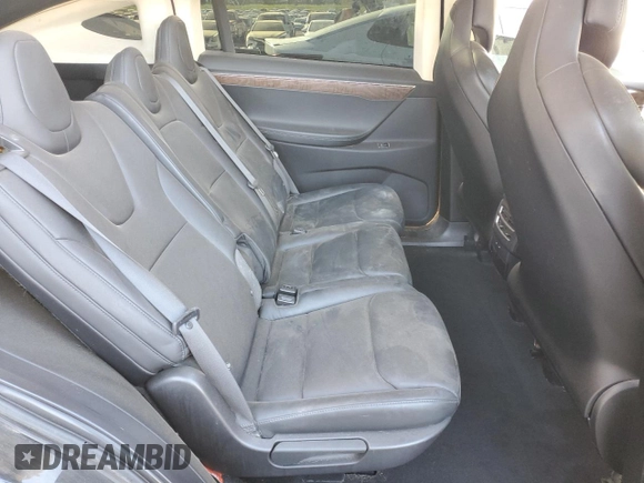 ✅ 2018 Tesla Model X 75D • VIN: 5YJXCDE2XJF091143 • Lot: 74115864. Listed on Copart with 104,939 mi. Free auction sales archive from the USA and detailed vehicle history report at DreamBid. Image 11.