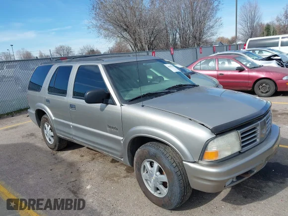 ✅ 1999 Oldsmobile Bravada • VIN: 1GHDT13W1X2714369 • Lot: 44505944. Wystawiony na IAAI z przebiegiem 162 205 mil. Bezpłatny archiwum sprzedaży aukcyjnych z USA i szczegółowy raport historii pojazdu na DreamBid. Zdjęcie 1.