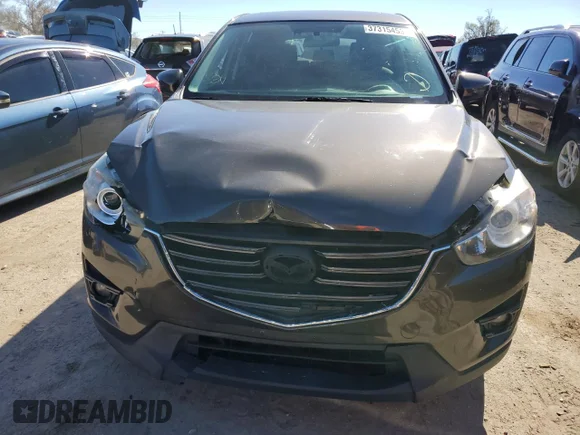 ✅ 2016 Mazda CX-5 Grand Touring • VIN: JM3KE2DY9G0762413 • Lot: 37315453. Wystawiony na Copart z przebiegiem 137 221 mil. Bezpłatny archiwum sprzedaży aukcyjnych z USA i szczegółowy raport historii pojazdu na DreamBid. Zdjęcie 5.