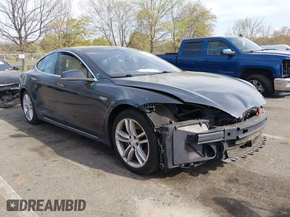 ✅ 2015 Tesla Model S 85D • VIN: 5YJSA1H2XFF089460 • Lot: 44876040. Listed on IAAI with 157,846 mi. Free auction sales archive from the USA and detailed vehicle history report at DreamBid. Image 1.