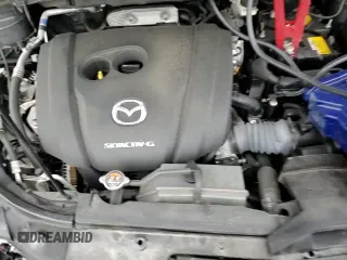 ✅ 2022 Mazda CX-5 S Carbon Edition • VIN: JM3KFBCM3N1585392 • Лот: 91692995. Опубликован ранее на Copart с пробегом 38 471 миль. Бесплатный доступ к архиву аукционных продаж из США и подробный отчёт об истории автомобиля на DreamBid. Изображение 15.