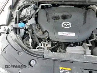 ✅ 2021 Mazda CX-5 Signature • VIN: JM3KFBEYXM0414787 • Лот: 64575355. Опубликован ранее на Copart с пробегом 90 199 миль. Бесплатный доступ к архиву аукционных продаж из США и подробный отчёт об истории автомобиля на DreamBid. Изображение 14.