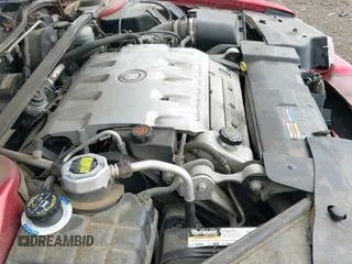 ✅ 2002 Cadillac Eldorado Touring ETC • VIN: 1G6ET12962B101911 • Lot: 42520564. Listed on IAAI with 154,584 mi. Free auction sales archive from the USA and detailed vehicle history report at DreamBid. Image 13.