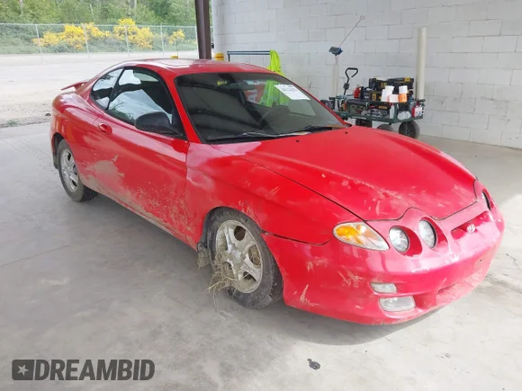 ✅ 2000 Hyundai Tiburon • VIN: KMHJG25F5YU215267 • Lot: 42322522. Wystawiony na IAAI z przebiegiem 162 683 mil. Bezpłatny archiwum sprzedaży aukcyjnych z USA i szczegółowy raport historii pojazdu na DreamBid. Zdjęcie 1.