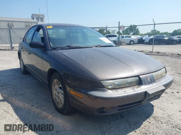✅ 1998 Saturn SL • VIN: 1G8ZJ5276WZ291081 • Lot: 42632567. Listed on IAAI with 238,130 mi. Free auction sales archive from the USA and detailed vehicle history report at DreamBid. Image 1.