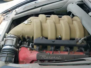 ✅ 2002 Maserati Spyder • VIN: ZAMBB18A520006915 • Lot: 42963343. Listed on IAAI with 61,386 mi. Free auction sales archive from the USA and detailed vehicle history report at DreamBid. Image 20.