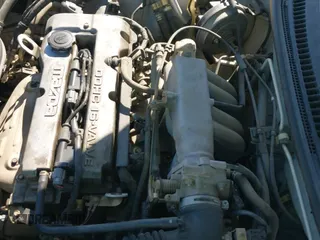 ✅ 2000 Mazda Protege DX • VIN: JM1BJ2224Y0231799 • Lot: 42374370. Listed on IAAI with 185,558 mi. Free auction sales archive from the USA and detailed vehicle history report at DreamBid. Image 18.