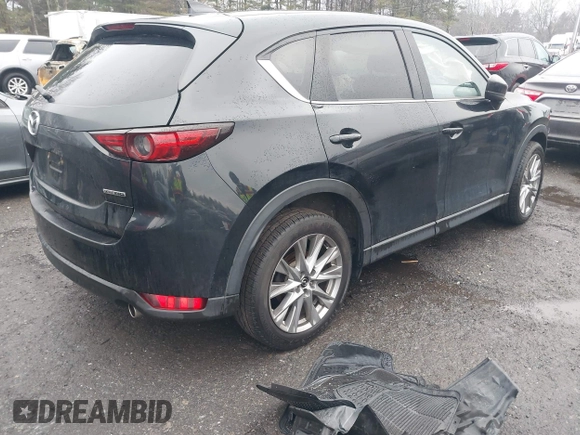 ✅ 2021 Mazda CX-5 Grand Touring • VIN: JM3KFADM3M1388598 • Lot: 44123879. Wystawiony na IAAI z przebiegiem 143 704 mil. Bezpłatny archiwum sprzedaży aukcyjnych z USA i szczegółowy raport historii pojazdu na DreamBid. Zdjęcie 4.