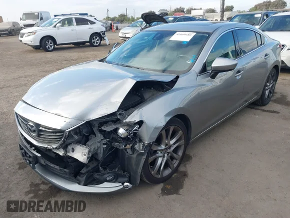 ✅ 2014 Mazda 6 i Grand Touring • VIN: JM1GJ1W65E1122853 • Лот: 41069185. Опубликован ранее на IAAI с пробегом 142 475 миль. Бесплатный доступ к архиву аукционных продаж из США и подробный отчёт об истории автомобиля на DreamBid. Изображение 2.