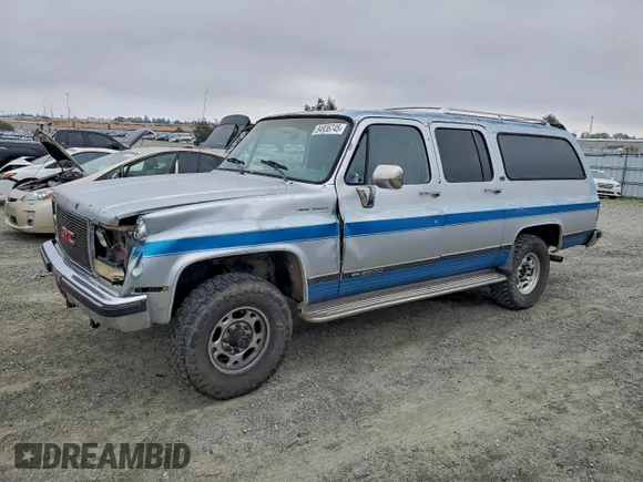 ✅ 1990 GMC Suburban • VIN: 1GKGV26K1LF500565 • Lot: 94936745. Listed on Copart with 206,493 mi. Free auction sales archive from the USA and detailed vehicle history report at DreamBid. Image 1.