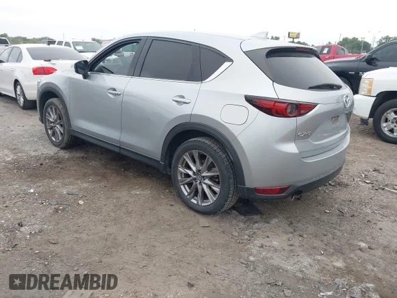 ✅ 2021 Mazda CX-5 Grand Touring • VIN: JM3KFADM2M1340123 • Lot: 45053965. Wystawiony na IAAI z przebiegiem 132 903 mil. Bezpłatny archiwum sprzedaży aukcyjnych z USA i szczegółowy raport historii pojazdu na DreamBid. Zdjęcie 3.