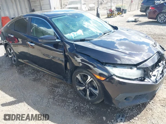 ✅ 2016 Honda Civic Touring • VIN: 2HGFC1F97GH631638 • Lot: 45189368. Listed on IAAI with 131,394 mi. Free auction sales archive from the USA and detailed vehicle history report at DreamBid. Image 1.