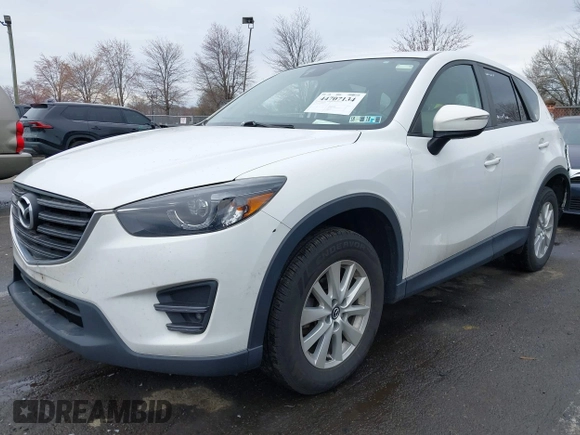 ✅ 2016 Mazda CX-5 Touring • VIN: JM3KE4CY0G0694452 • Lot: 44707134. Wystawiony na IAAI z przebiegiem 149 031 mil. Bezpłatny archiwum sprzedaży aukcyjnych z USA i szczegółowy raport historii pojazdu na DreamBid. Zdjęcie 2.