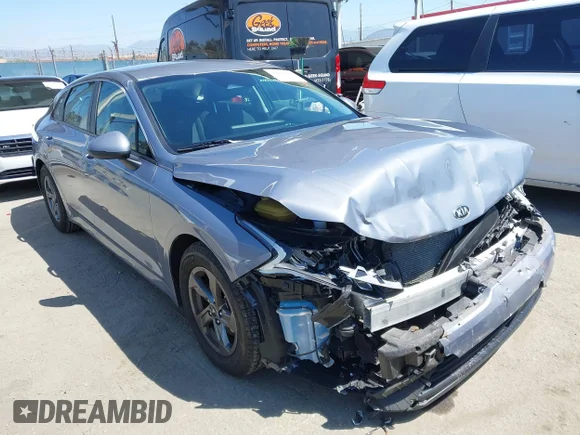 ✅ 2021 Kia K5 LXS • VIN: 5XXG14J26MG057794 • Лот: 42003382. Опубликован ранее на IAAI с пробегом 19 217 миль. Бесплатный доступ к архиву аукционных продаж из США и подробный отчёт об истории автомобиля на DreamBid. Изображение 1.