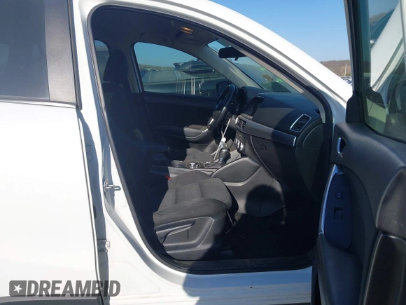 ✅ 2016 Mazda CX-5 Touring • VIN: JM3KE2CY8G0827009 • Lot: 44713498. Wystawiony na IAAI z przebiegiem 160 703 mil. Bezpłatny archiwum sprzedaży aukcyjnych z USA i szczegółowy raport historii pojazdu na DreamBid. Zdjęcie 5.