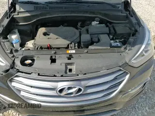 2018 Hyundai Santa Fe 2.4L z VIN 5NMZUDLB0JH058434, wystawiony jako Copart lot #80943575 z przebiegiem 100 658 mil mil oraz Szkoda całkowita • Salvage title. Historia ofert i sprzedaży dostępna na DreamBid. Obrazek 16.