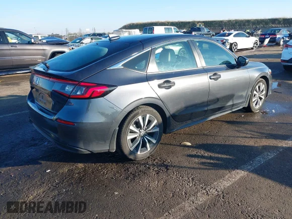 ✅ 2023 Honda Civic EX-L • VIN: 19XFL1H77PE012706 • Lot: 41309072. Wystawiony na IAAI z przebiegiem 20 914 mil. Bezpłatny archiwum sprzedaży aukcyjnych z USA i szczegółowy raport historii pojazdu na DreamBid. Zdjęcie 4.