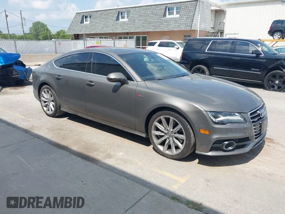 ✅ 2014 Audi A7 Prestige • VIN: WAU2GAFC0EN118990 • Lot: 43010017. Listed on IAAI with 126,529 mi. Free auction sales archive from the USA and detailed vehicle history report at DreamBid. Image 1.