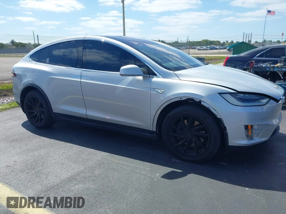 ✅ 2016 Tesla Model X 70D • VIN: 5YJXCBE25GF019120 • Lot: 44890871. Listed on IAAI with 185,000 mi. Free auction sales archive from the USA and detailed vehicle history report at DreamBid. Image 1.