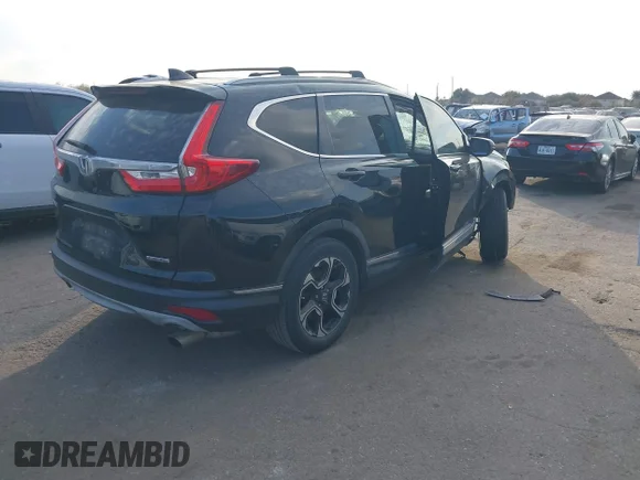 ✅ 2017 Honda CR-V Touring • VIN: 2HKRW1H9XHH512121 • Лот: 43976704. Опубліковано раніше на IAAI з пробігом 158 954 миль. Безкоштовний доступ до архіву аукціонних продажів зі США та докладний звіт про історію автомобіля на DreamBid. Зображення 4.