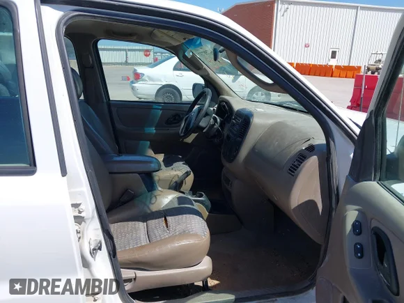 ✅ 2002 Ford Escape XLS Choice • VIN: 1FMYU01122KD51087 • Lot: 42798737. Listed on IAAI with 211,770 mi. Free auction sales archive from the USA and detailed vehicle history report at DreamBid. Image 5.
