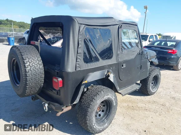 ✅ 2000 Jeep Wrangler Sport • VIN: 1J4FA49S8YP775825 • Lot: 43063386. Listed on IAAI with 185,505 mi. Free auction sales archive from the USA and detailed vehicle history report at DreamBid. Image 4.