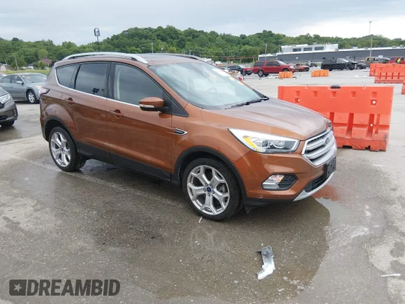 ✅ 2017 Ford Escape Titanium • VIN: 1FMCU0J91HUB59012 • Лот: 45063688. Опубликован ранее на IAAI с пробегом 64 653 миль. Бесплатный доступ к архиву аукционных продаж из США и подробный отчёт об истории автомобиля на DreamBid. Изображение 1.