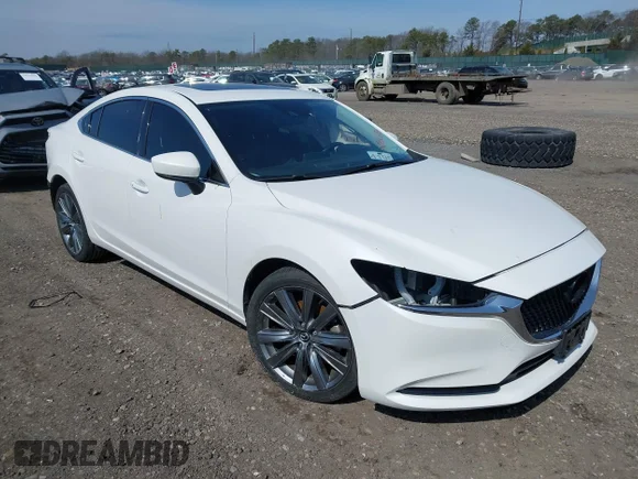 ✅ 2021 Mazda 6 Grand Touring • VIN: JM1GL1TY7M1616212 • Lot: 44674368. Wystawiony na IAAI z przebiegiem 47 527 mil. Bezpłatny archiwum sprzedaży aukcyjnych z USA i szczegółowy raport historii pojazdu na DreamBid. Zdjęcie 1.