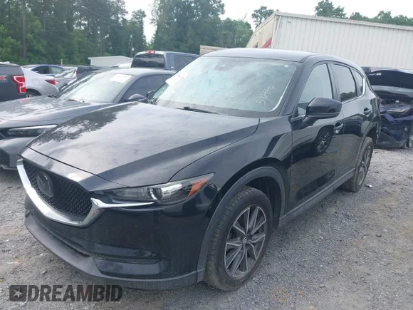 ✅ 2018 Mazda CX-5 Touring • VIN: JM3KFACM9J1316446 • Lot: 45240640. Listed on IAAI with 120,941 mi. Free auction sales archive from the USA and detailed vehicle history report at DreamBid. Image 2.