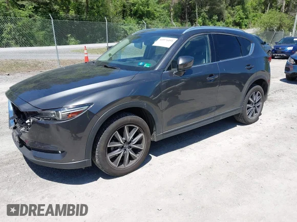 ✅ 2018 Mazda CX-5 Grand Touring • VIN: JM3KFBDM4J0402418 • Lot: 44974491. Listed on IAAI with 153,942 mi. Free auction sales archive from the USA and detailed vehicle history report at DreamBid. Image 19.