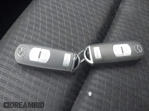 ✅ 2015 Mazda CX-5 Touring • VIN: JM3KE2CY1F0537077 • Lot: 45390594. Listed on IAAI with 164,711 mi. Free auction sales archive from the USA and detailed vehicle history report at DreamBid. Image 11.