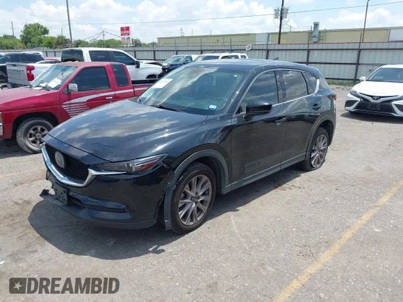 ✅ 2019 Mazda CX-5 Grand Touring • VIN: JM3KFADM3K0644144 • Лот: 45263545. Опубліковано раніше на IAAI з пробігом 91 125 миль. Безкоштовний доступ до архіву аукціонних продажів зі США та докладний звіт про історію автомобіля на DreamBid. Зображення 2.