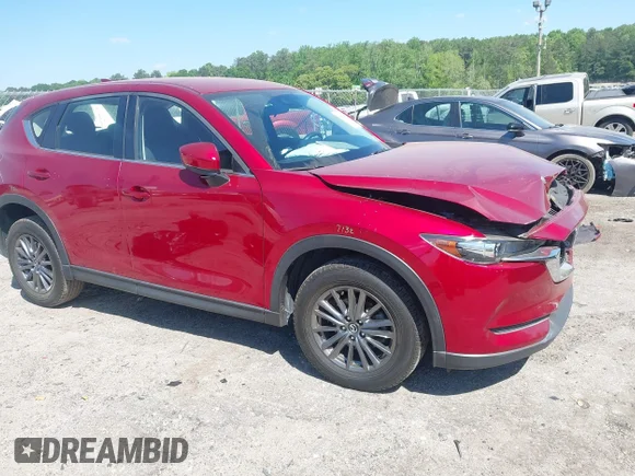 ✅ 2021 Mazda CX-5 Sport • VIN: JM3KFABM0M1300514 • Lot: 44861540. Wystawiony na IAAI z przebiegiem 59 373 mil. Bezpłatny archiwum sprzedaży aukcyjnych z USA i szczegółowy raport historii pojazdu na DreamBid. Zdjęcie 1.