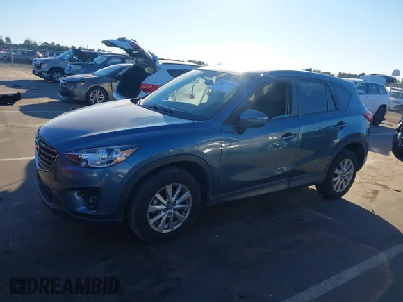 ✅ 2016 Mazda CX-5 Touring • VIN: JM3KE2CY9G0900095 • Лот: 44174230. Опубликован ранее на IAAI с пробегом 124 171 миль. Бесплатный доступ к архиву аукционных продаж из США и подробный отчёт об истории автомобиля на DreamBid. Изображение 2.