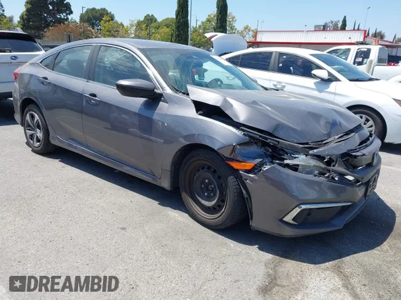 ✅ 2019 Honda Civic LX • VIN: 19XFC2F69KE209076 • Лот: 45466795. Опубліковано раніше на IAAI з пробігом 99 426 миль. Безкоштовний доступ до архіву аукціонних продажів зі США та докладний звіт про історію автомобіля на DreamBid. Зображення 1.