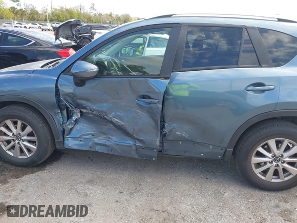 ✅ 2016 Mazda CX-5 Touring • VIN: JM3KE2CY3G0743051 • Lot: 44482940. Wystawiony na IAAI z przebiegiem 129 079 mil. Bezpłatny archiwum sprzedaży aukcyjnych z USA i szczegółowy raport historii pojazdu na DreamBid. Zdjęcie 6.